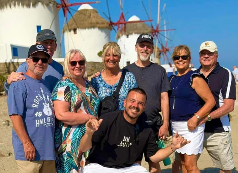 Small tour group with local guide at Mykonos windmills during a Mykonos island nightlife and sightseeing tour